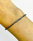 Natural sapphire bracelet detail, round royal blue sapphires in yellow gold - Cherry Pick Diamonds