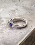Trio 1.05 Euro platinum three stone ring side view with sapphire – Cherry Pick Diamonds St. Louis MO