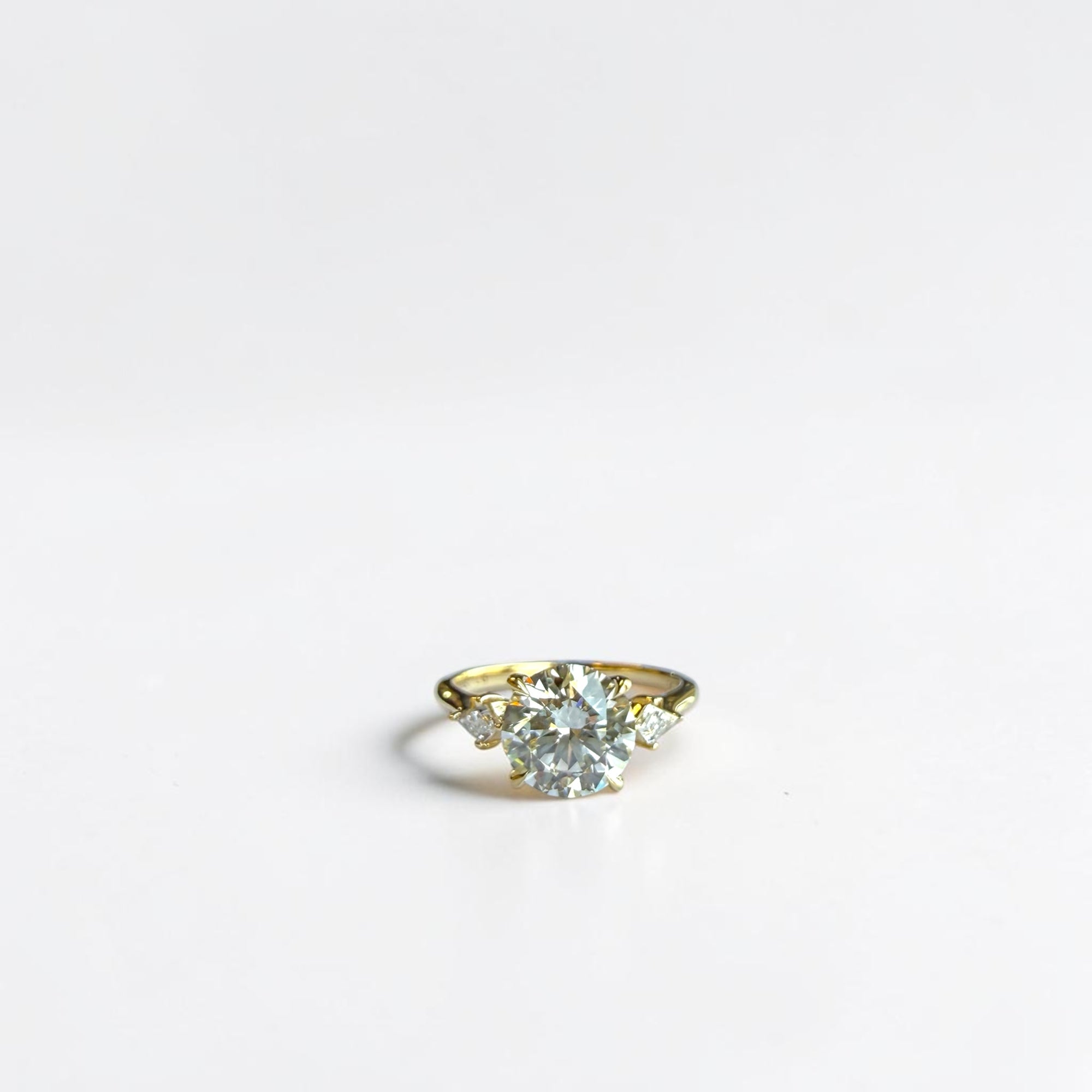 2.16 carat IGI lab diamond round brilliant three stone ring with kite step cut sides in 14k yellow gold — Cherry Pick Diamonds Clayton MO