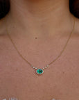 0.66 carat Colombian emerald oval diamond halo pendant necklace in 18K yellow gold, Cherry Pick Diamonds Clayton MO