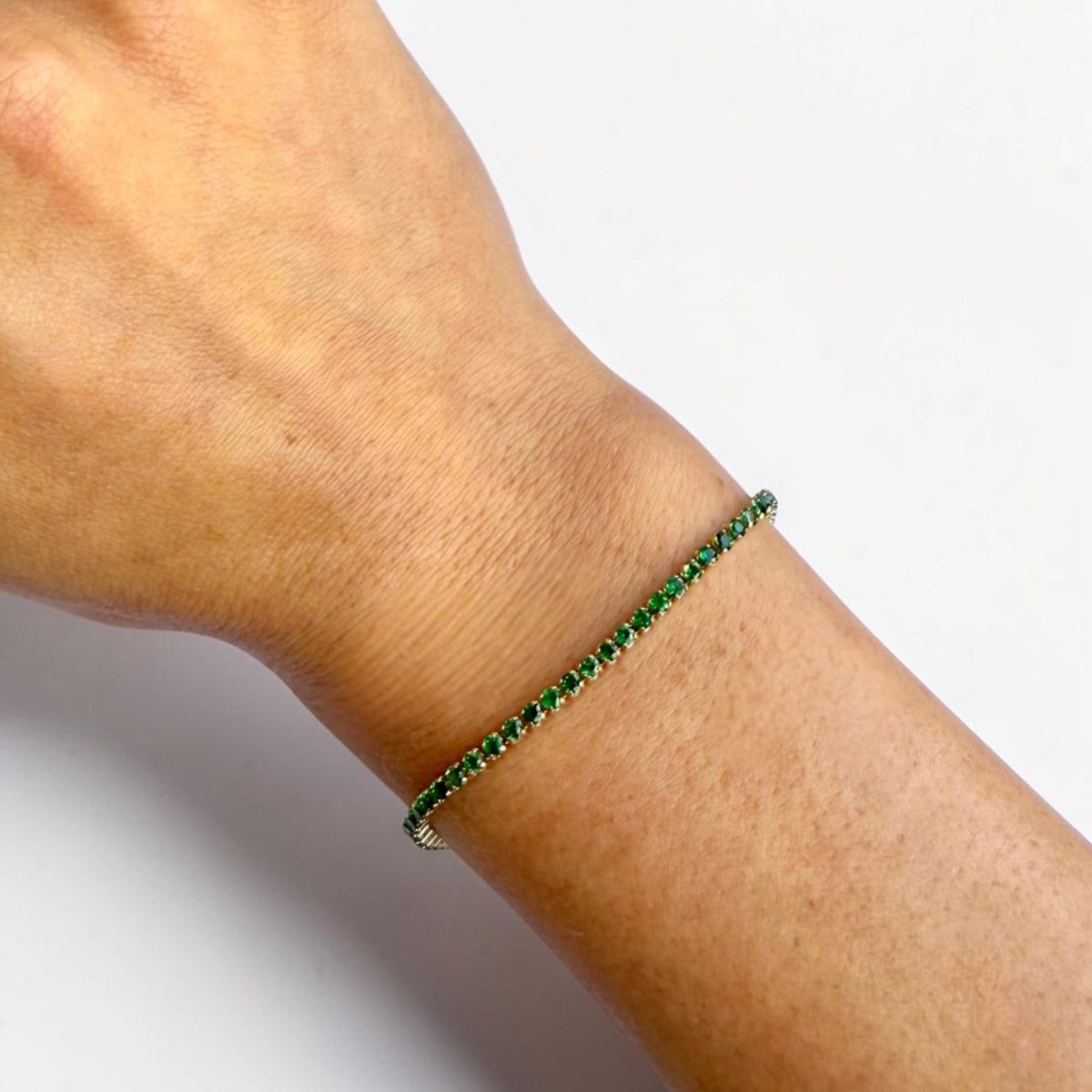 Natural Colombian emerald bracelet detail, round green emeralds in yellow gold - Cherry Pick Diamonds