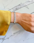 Close-up of antique-style milgrain detail on old European cut diamond tennis bracelet