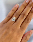 Monaco white gold pear shape diamond bezel ring close-up – Cherry Pick Diamonds Clayton MO