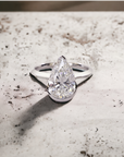 Monaco WG engagement ring in white gold with knife edge half bezel for pear shape diamond – Cherry Pick Diamonds Clayton St. Louis MO