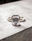 Bergamo WG engagement ring in 14K white gold with bezel set emerald cut lab created diamond – Cherry Pick Diamonds Clayton St. Louis MO