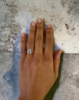 Bergamo WG engagement ring close-up, white gold bezel emerald cut – Cherry Pick Diamonds Clayton MO