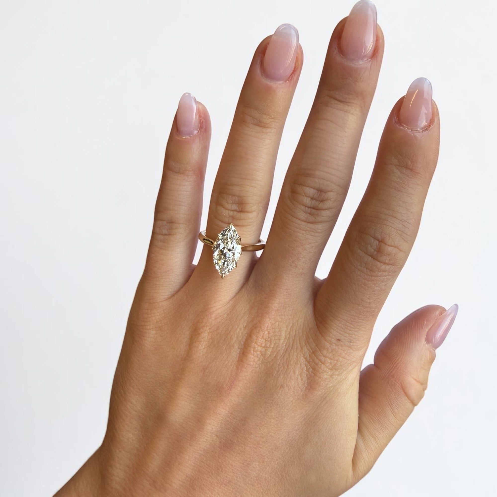 Close-up of 2.51ct marquise lab diamond in tulip head six prong yellow gold setting — Cherry Pick Diamonds Clayton Missouri