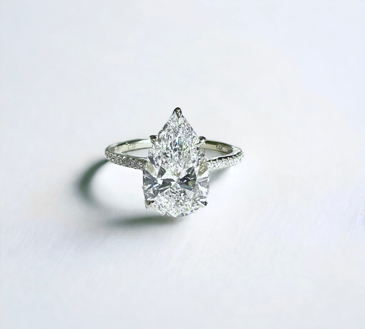 Paris Pear hidden halo engagement ring side view, pear shape lab created diamond – Cherry Pick Diamonds St. Louis MO