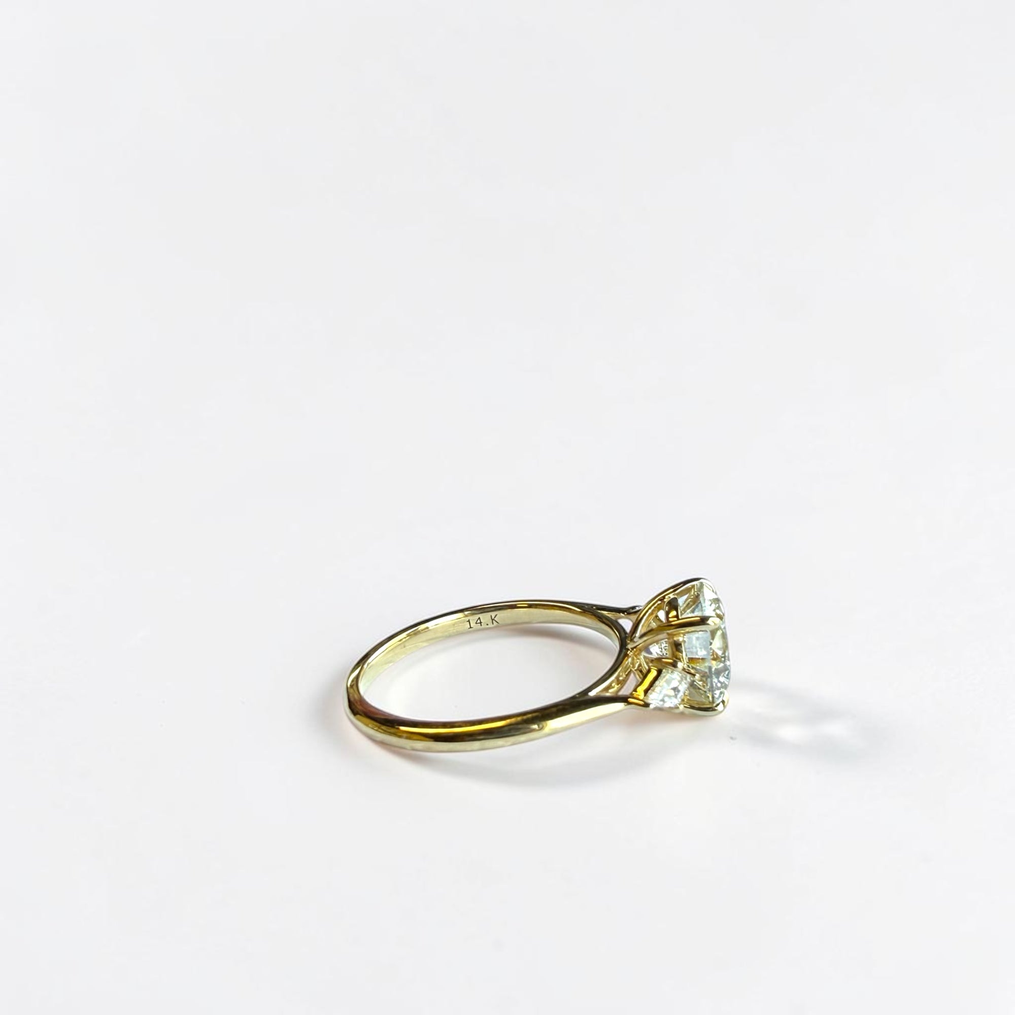 Round Trio Kite engagement ring side view showing kite shaped diamond accents — Cherry Pick Diamonds St. Louis