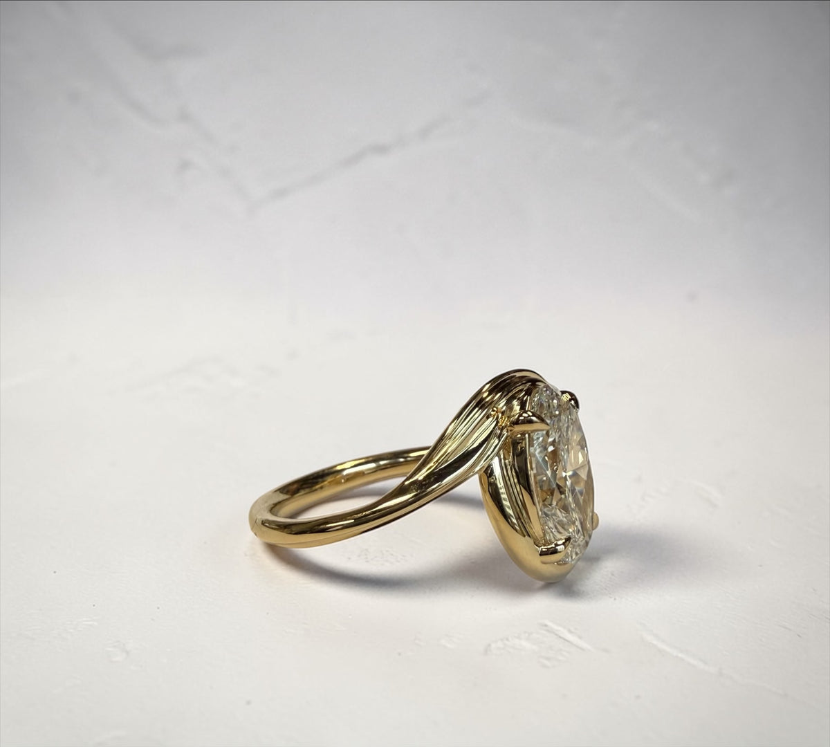 Spartan Oval ring side view, spiraling solitaire design with oval diamond – Cherry Pick Diamonds St. Louis MO