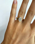 Close-up of 2.06ct F color oval brilliant natural diamond in yellow gold hidden halo setting — Cherry Pick Diamonds Clayton Missouri
