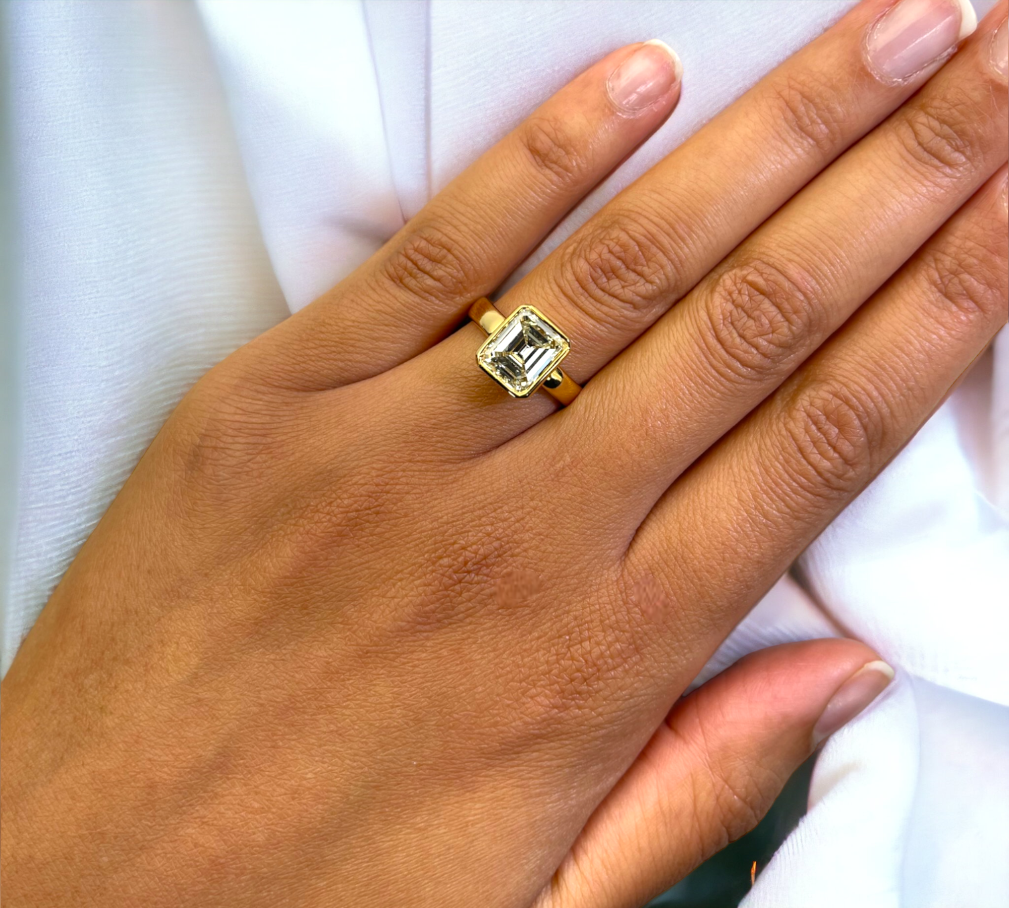 Bergamo 3.68 natural emerald cut diamond bezel close-up, yellow gold – Cherry Pick Diamonds Clayton MO