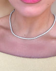 Close-up of natural diamond tennis necklace prong settings in white gold - Cherry Pick Diamonds