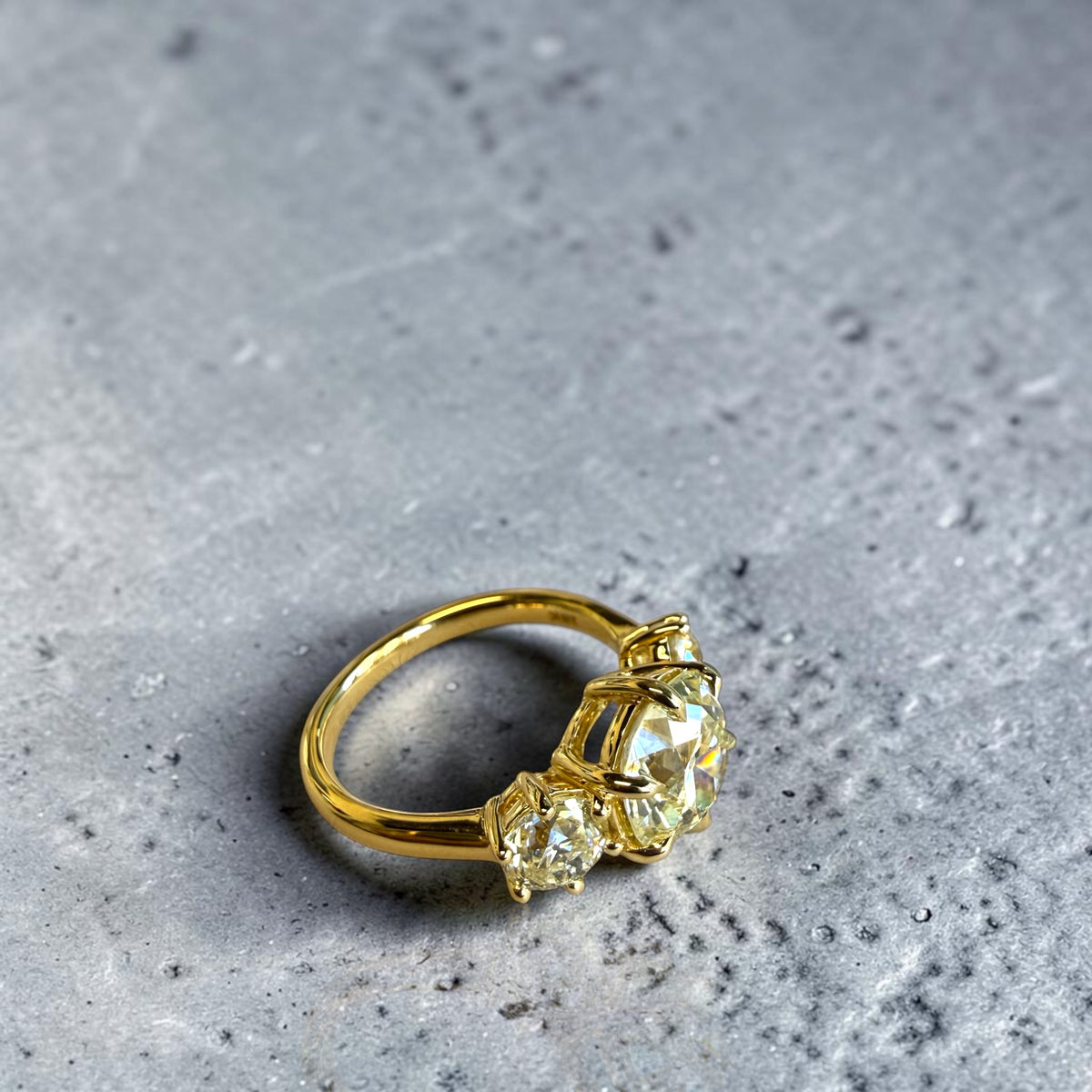 Side view of antique three stone diamond ring with Old Mine and Old European cut diamonds in 18K yellow gold, Cherry Pick Diamonds