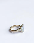 Close-up of emerald cut trio engagement ring with matching side diamonds, St. Louis fine jewelry