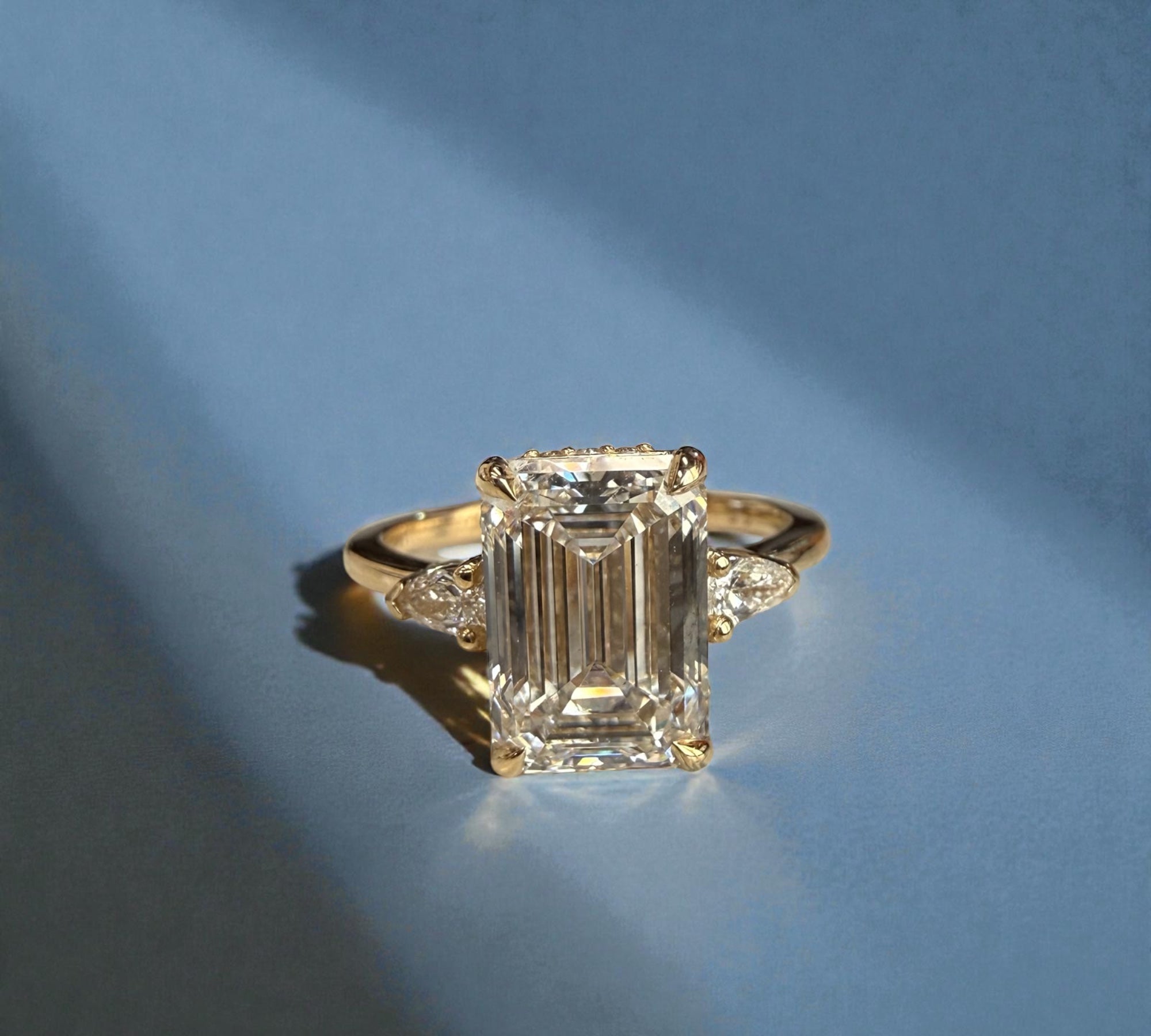 Trio Emerald Pears three stone ring in 14K yellow gold with 3.64ct emerald cut lab created diamond and pear side stones – Cherry Pick Diamonds Clayton St. Louis MO