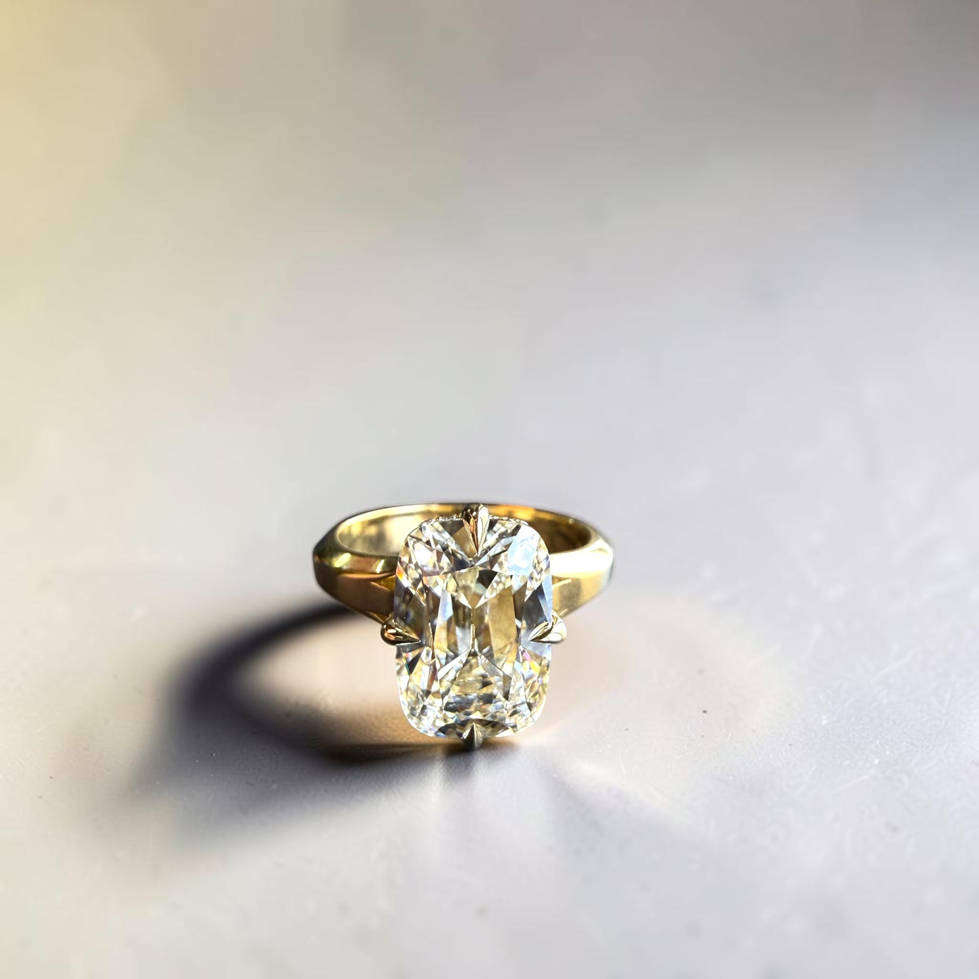 4.52 carat F VVS2 IGI lab elongated old mine cut diamond ring with compass claw hidden halo and three tier shank in 14k yellow gold — Cherry Pick Diamonds Clayton MO