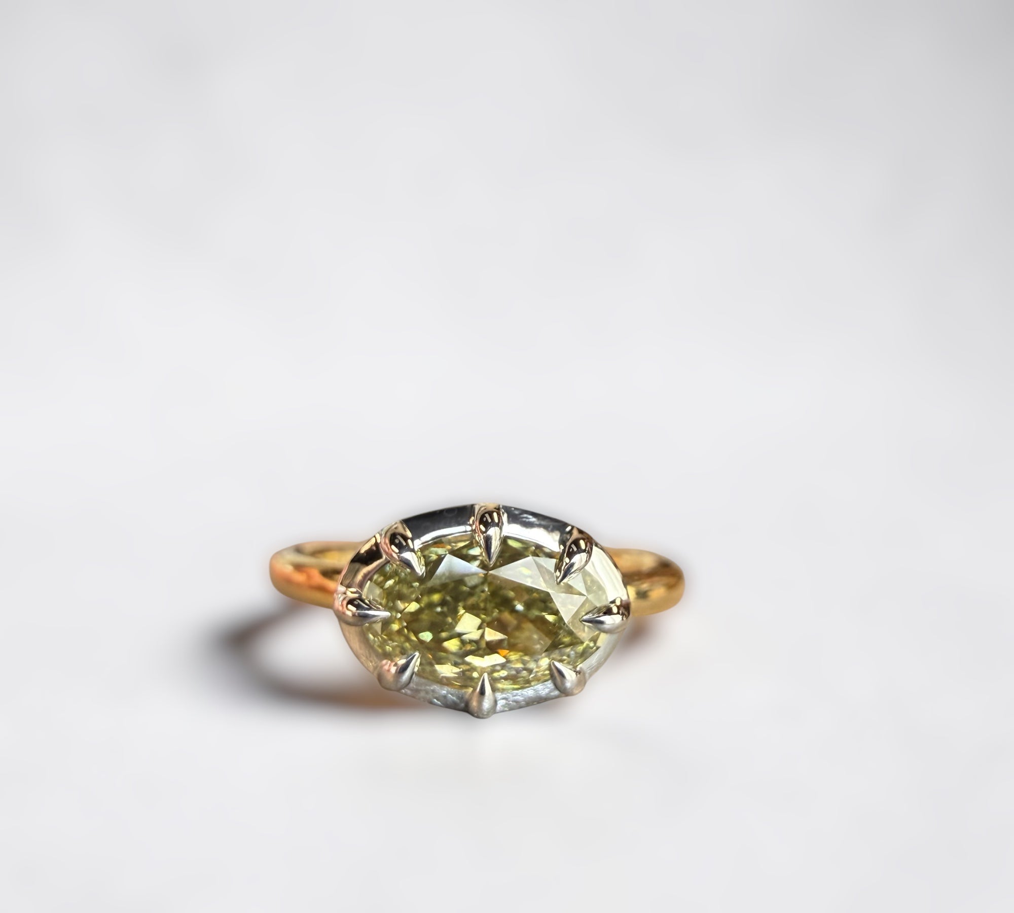 1.50 carat natural chameleon oval diamond solitaire engagement ring in two-tone 18k yellow gold and 14k white gold setting - custom jewelry by Cherry Pick Diamonds, Clayton MO near Ladue and Frontenac