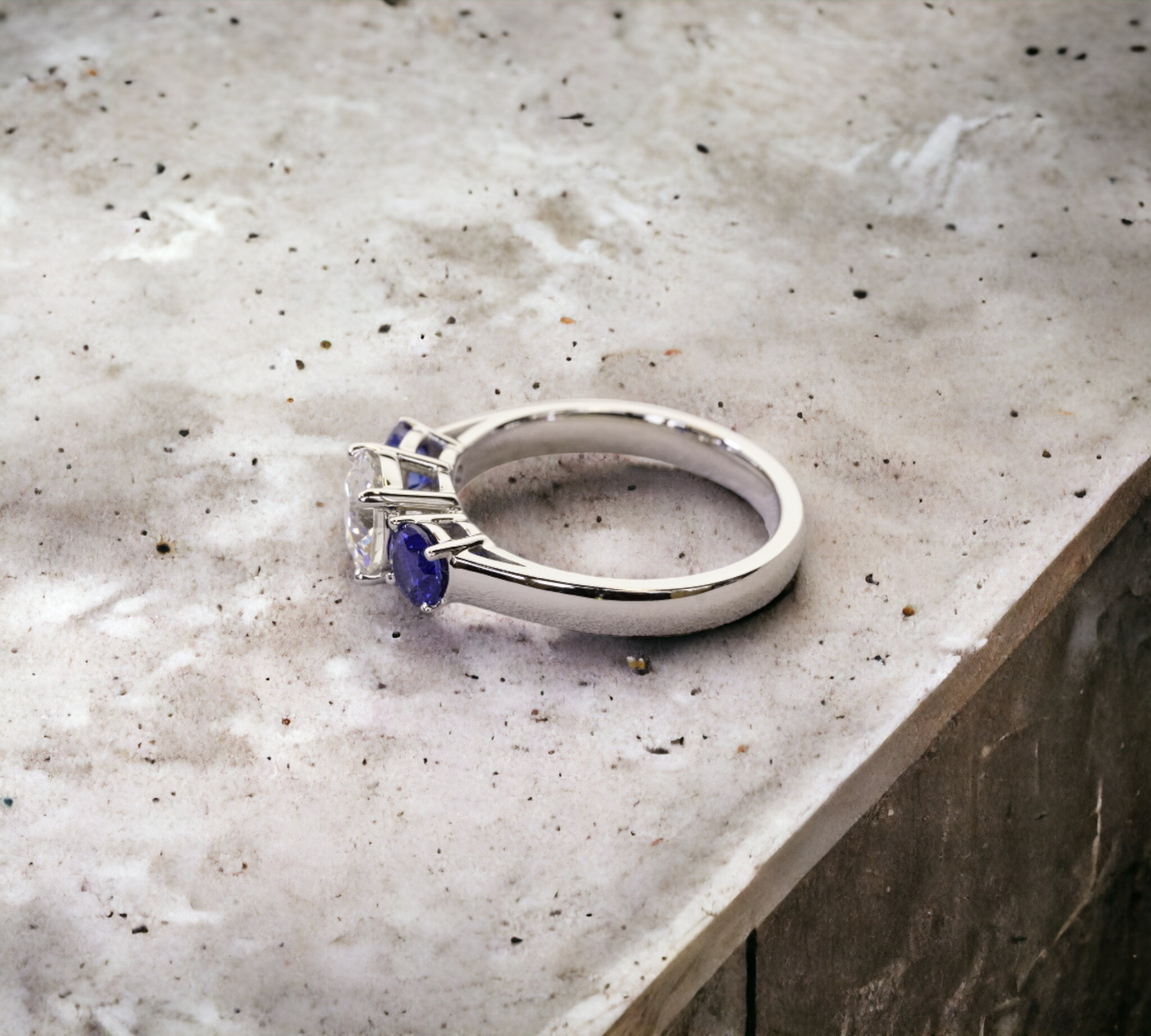 Trio 1.05 Euro platinum three stone ring side view with sapphire – Cherry Pick Diamonds St. Louis MO