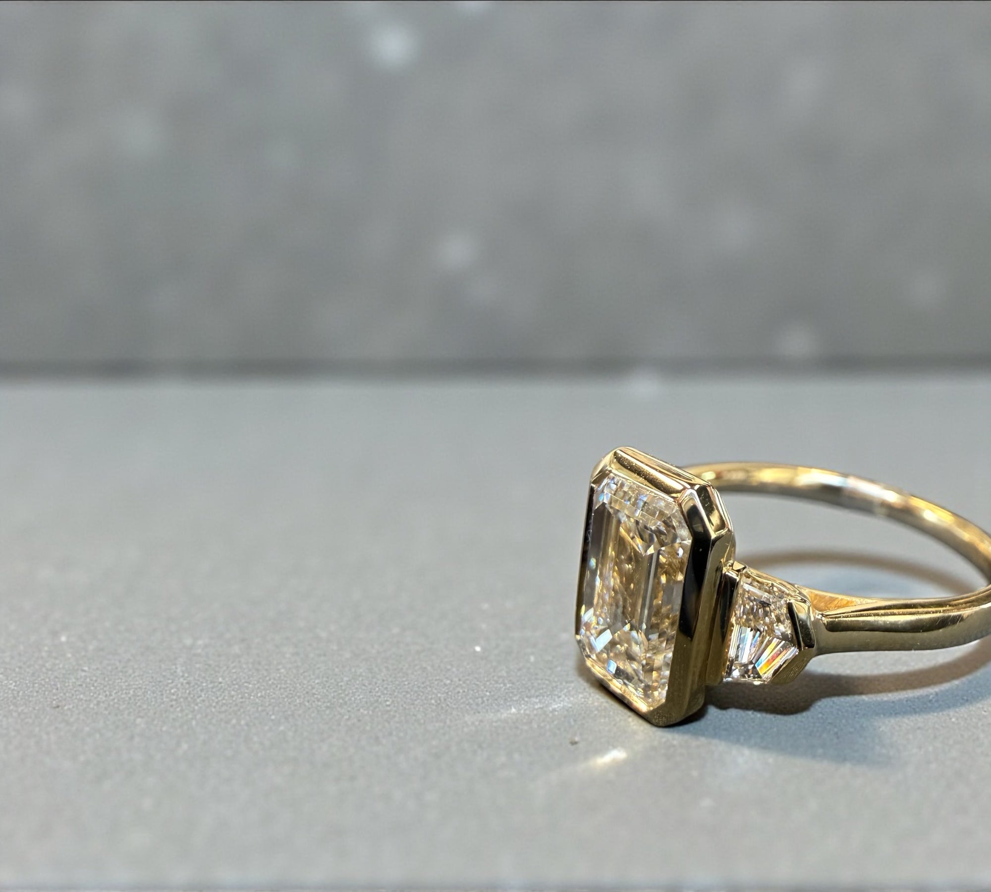 Trio Shield Emerald ring side view, shield cut diamonds – Cherry Pick Diamonds St. Louis MO