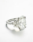 Trio Oval 6.42 platinum three stone ring side view with half moon diamonds – Cherry Pick Diamonds St. Louis MO