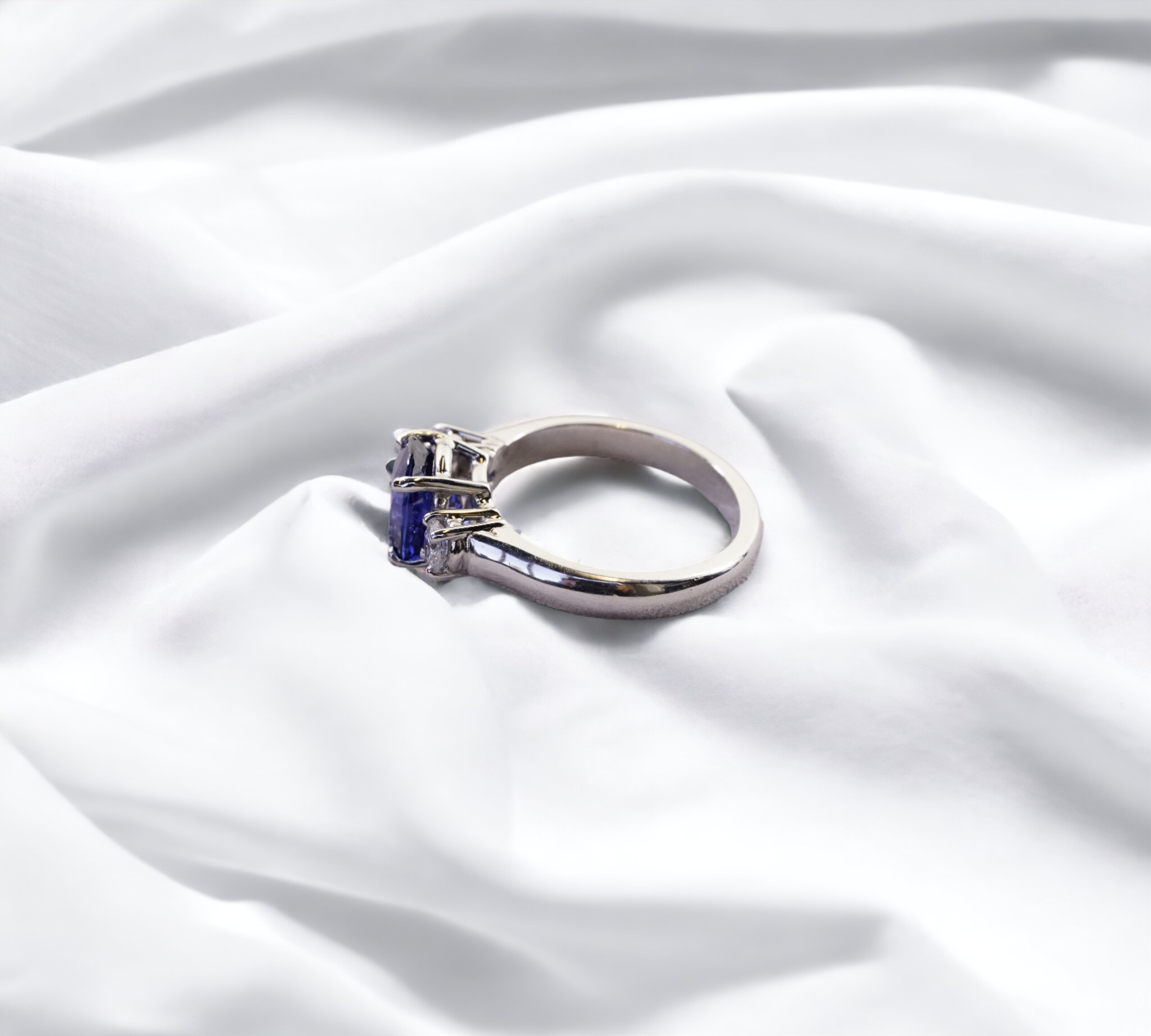Trio Sapphire Ring platinum oval blue sapphire with diamond side stones – Cherry Pick Diamonds St. Louis MO